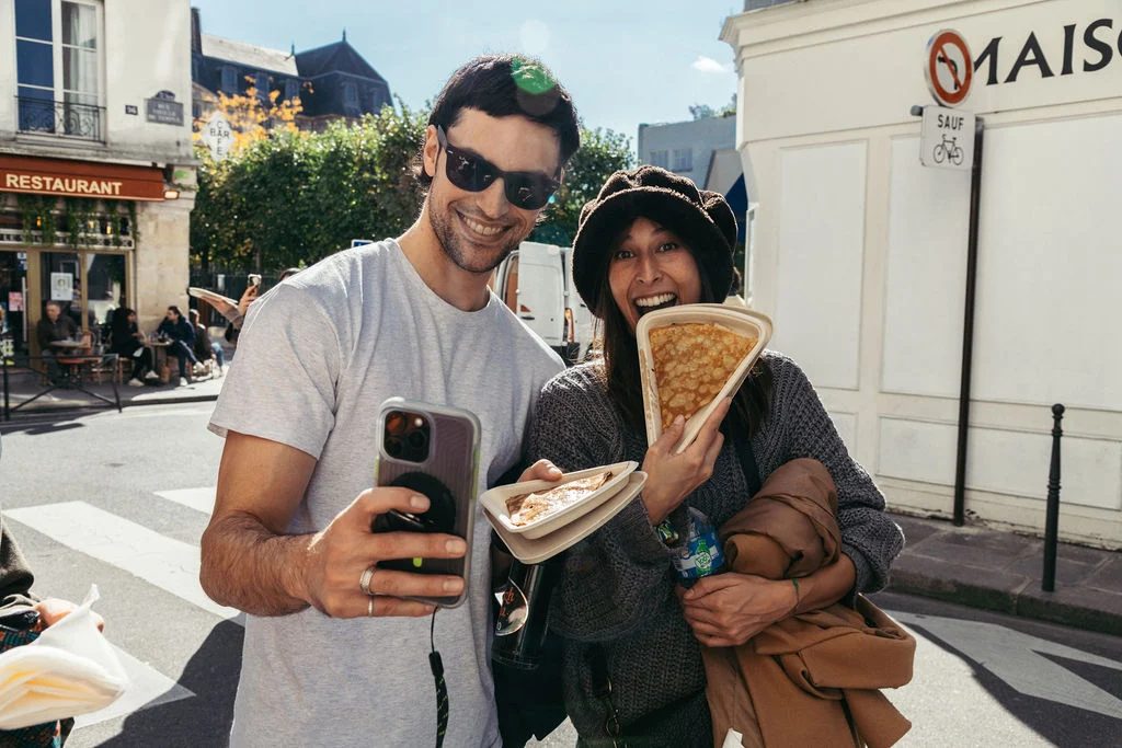 people_taking_a_photo_with_a_crepe_from_Breizh_Cafe_Paris