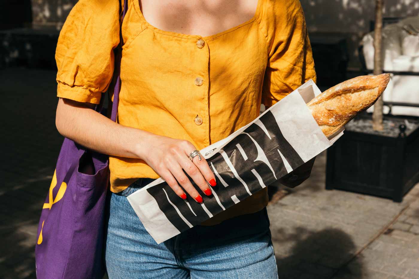 lady_eating_baguettes_Thierry_Marx_Bakery_Paris